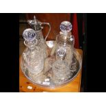 A set of glass decanters and other receptacles on