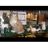 A Beswick cat ornament, together with others