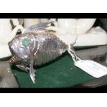 An unusual articulated silver fish pepperette