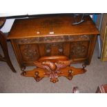 A carved oak blanket box, together with a coat han