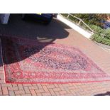 A Middle Eastern style carpet with geometric borde