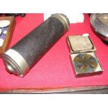 An antique kaleidoscope with a selection of boxed