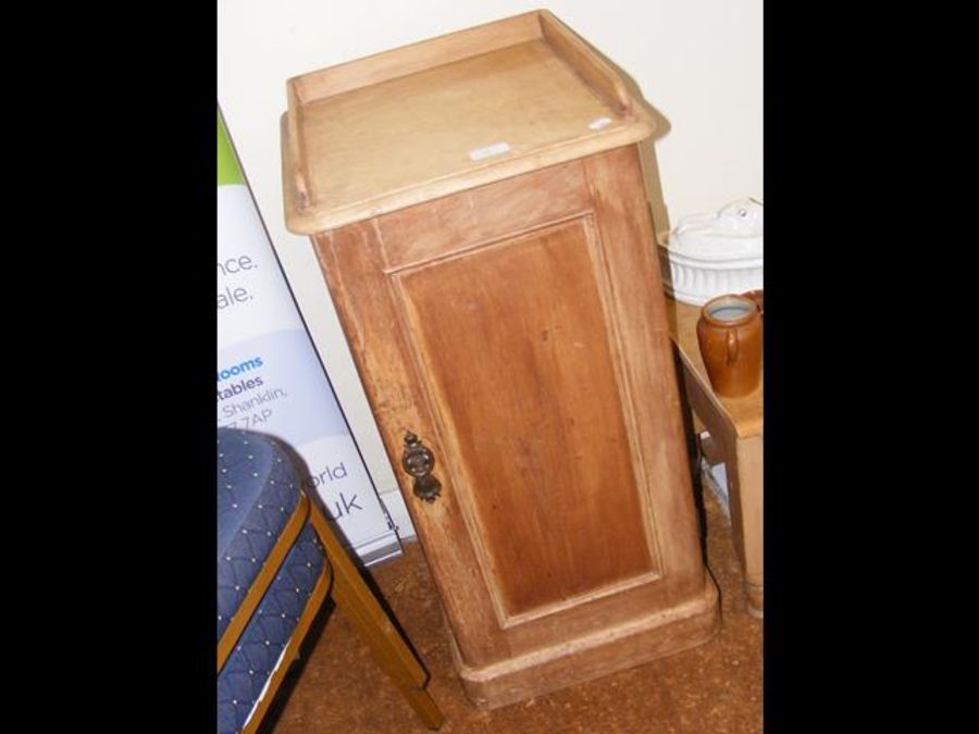 An antique pine pot cupboard