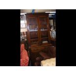 A Victorian bookcase with glazed upper section, dr