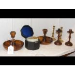 A pair of travelling olive wood candlesticks, font