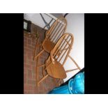 Two retro light wood Ercol rocking chairs