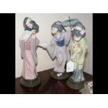 A Lladro figure of Japanese lady together with two