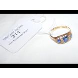 An 18ct gold ring with sapphire and diamond mount