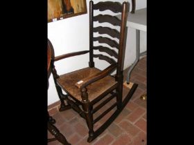 A ladder back rocking chair