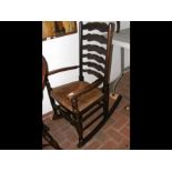 A ladder back rocking chair