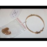 A rolled gold bracelet with a pair of 9ct gold cuff l