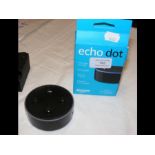 An Amazon Echo Dot in box