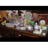 An assortment of glass collectables, including pap
