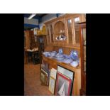 A large pine farmhouse dresser with glazed upper s