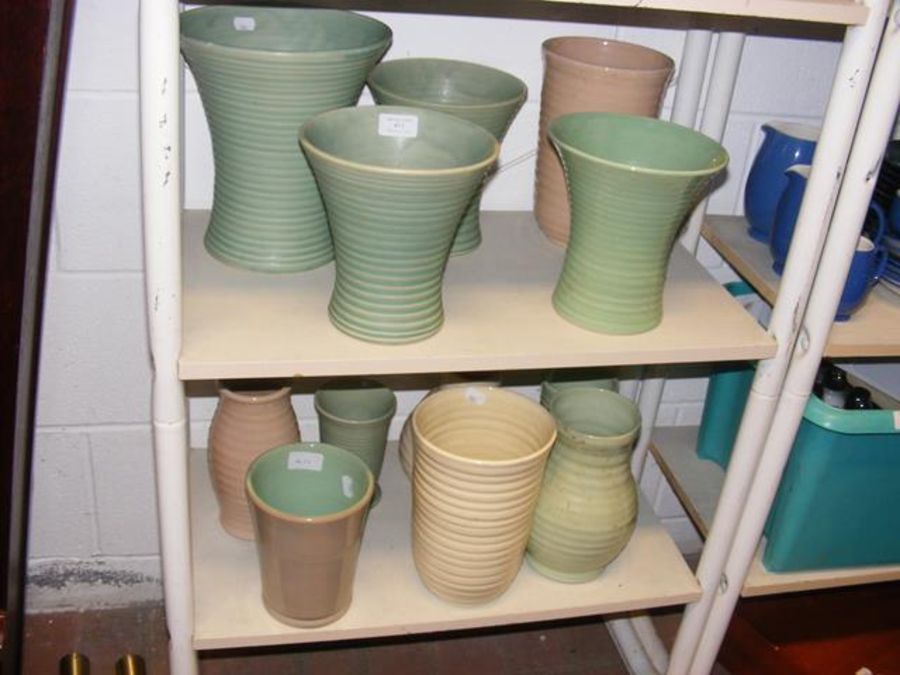 A collection of ceramic glass vases, including Den