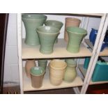 A collection of ceramic glass vases, including Den