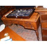 A Victorian mahogany desk with five drawers to the