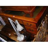 A mahogany pedestal desk with green leather inlay