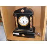 A slate and marble mantel clock, having architectu