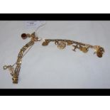 A 9ct gold charm bracelet, together with one other