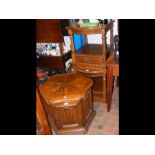 A pair of two tiered occasional tables with glass