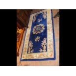 A Chinese hall rug - 185cm x 94cm