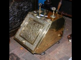 A decorative Victorian brass coal scuttle with sho