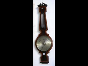 An Edwardian wheel barometer/thermometer by Marlow