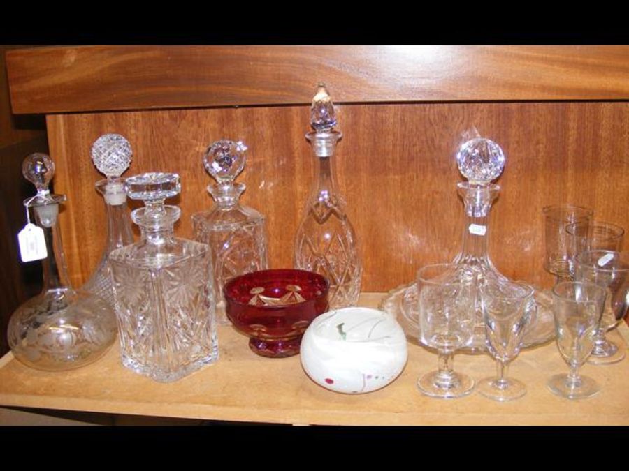 A medley of glassware, including ship's decanters