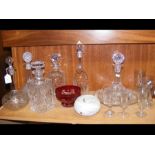 A medley of glassware, including ship's decanters