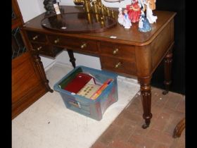 A Victorian mahogany desk with fluted legs