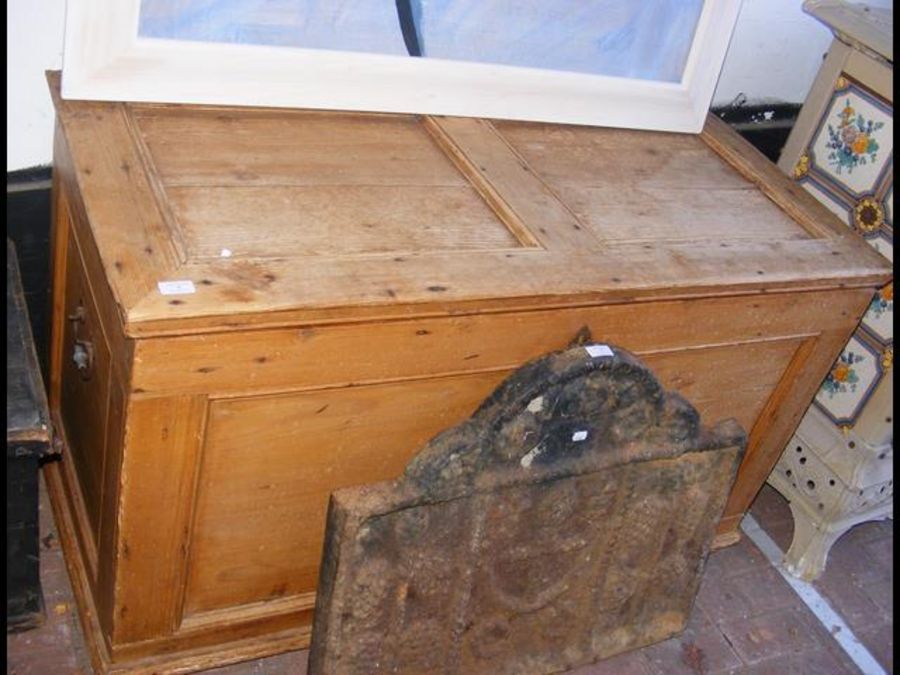 An antique pine panelled chest - 125cms wide