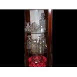 An assortment of glassware, including decanters an