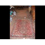 A Middle Eastern style rug with geometric border,