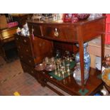 A bow front dressing table with spindle legs