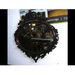 A decorative antique style oval wall mirror - 86cm