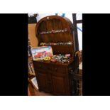 A reproduction oak dresser with two drawers and tw