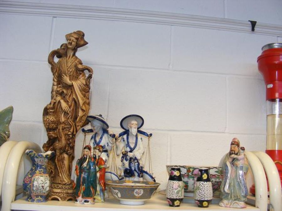 An assortment of oriental style figures and collec