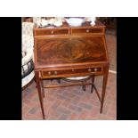 An Edwardian mahogany bureau with fitted interior