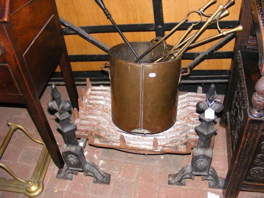 A fire grate with dogs, together with fire irons e