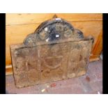 A cast iron fire back with central anchor - 70cm w