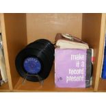 A quantity of 45rpm records - on stand and in case