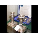 A pair of silver candlesticks and six fruit forks - cased
