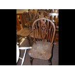 A set of five spindle and wheel back dining chairs