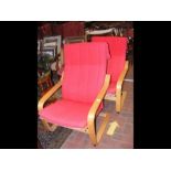 A pair of IKEA Poang armchairs, oak veener/striking red