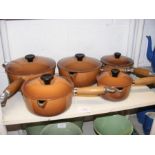 A suite of Le Creuset cast iron lidded cooking pot