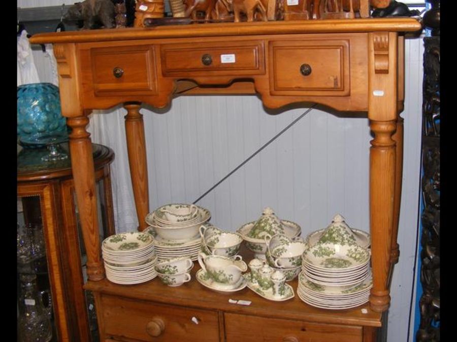 A pine knee hole dressing table with three small d
