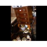 A mahogany bedside chest of drawers - width 40cms