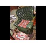 A button back easy armchair upholstered in green l