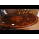 An inlaid oval serving tray